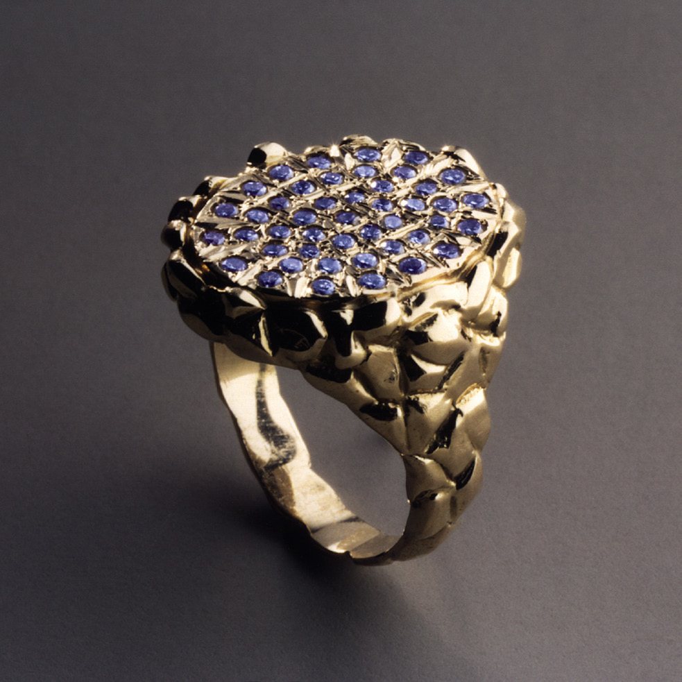Gold ring with a round pavé-set bezel